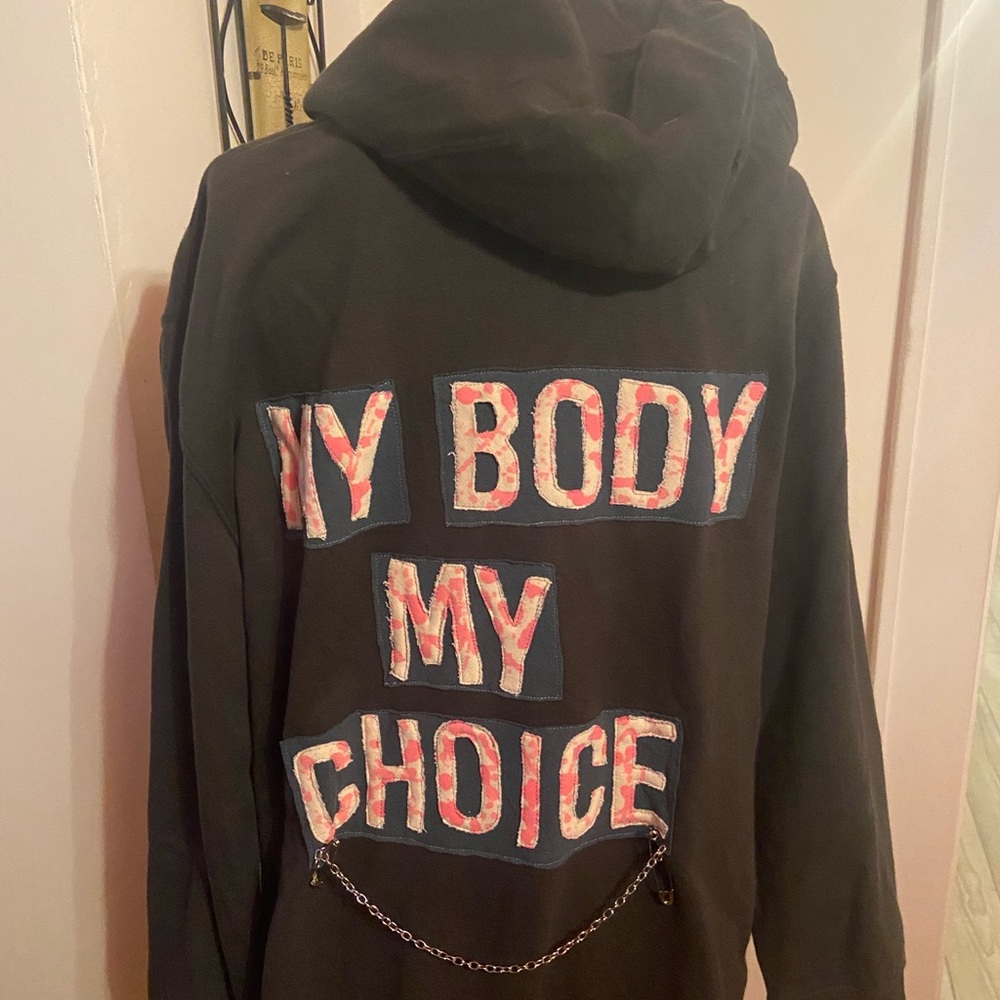 Dark grey hoodie.. design on the back and front was custom designed.